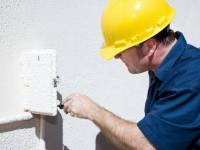 _____ bigstockphoto_Electrician_Working_In_Electri_3120082